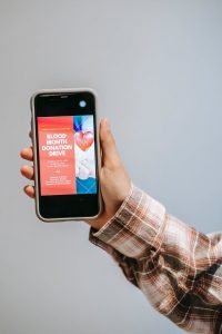 person holding black smartphone